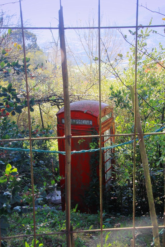 Strange phone booth on top of a mountain in the middle of nowhere
