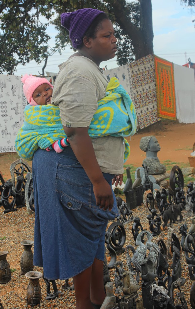 Some day I'm going to learn how to tie a baby up like that