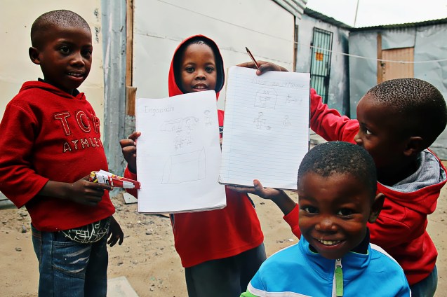 Little boys proud of their art work